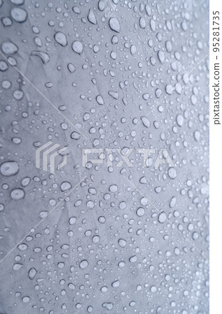 Raindrops on a blue tent close-up. Foggy morning in the Carpathians. Raindrops on a blue tent close-up. Foggy morning in the Carpathians. 95281735