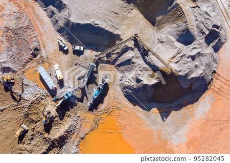 An overview stone crushing equipment that is being used to pulverize rock stones for production gravel using mechanical conveyor belt An overview stone crushing equipment that is being used to pulverize rock stones for production gravel using mechanical conveyor belt 95282045