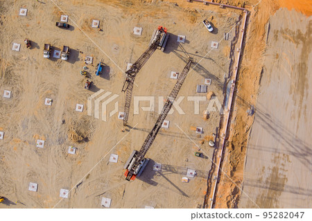 Truck mounted pump would be mounted construction site drilling soil under columns high pressure pour pumping concrete sweat earth when vertical piling foundation work needed Truck mounted pump would be mounted construction site drilling soil under columns high pressure pour pumping concrete sweat earth when vertical piling foundation work needed 95282047