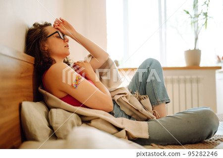 Woman blogger videotapes her vlog at home and speaking about Vaccine for covid-19. Woman blogger videotapes her vlog at home and speaking about Vaccine for covid-19. 95282246