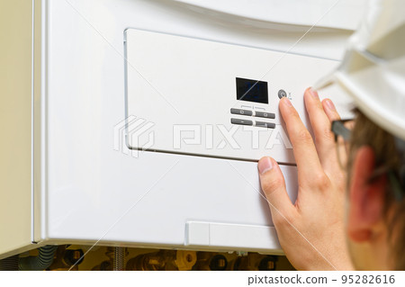 Setting up and servicing by a service department. Adjustment of gas boiler at domestic home. 95282616