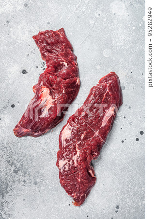 Machete steak raw cut or hanging tender cut. Gray background. Top view 95282949