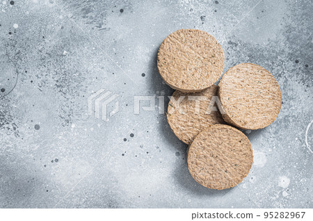 Raw Meat Free Plant Based Burger patties, vegetarian cutlets. Gray background. Top view. Copy space Raw Meat Free Plant Based Burger patties, vegetarian cutlets. Gray background. Top view. Copy space 95282967