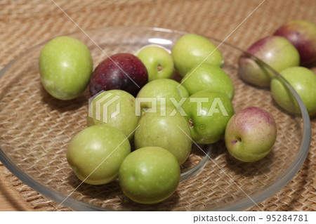 Olives and Olive Oil on wooden background 95284781