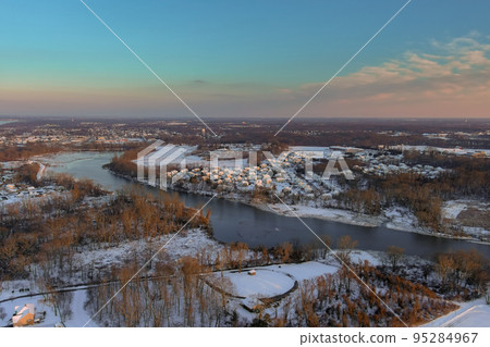 Snow on American town an house complex near small river in middle of snowy winter landscape after snowfall Snow on American town an house complex near small river in middle of snowy winter landscape after snowfall 95284967
