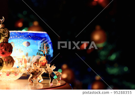 Image of Christmas: Christmas tree, ginger cookies and reindeer glass miscellaneous goods on the table Image of Christmas: Christmas tree, ginger cookies and reindeer glass miscellaneous goods on the table 95288355
