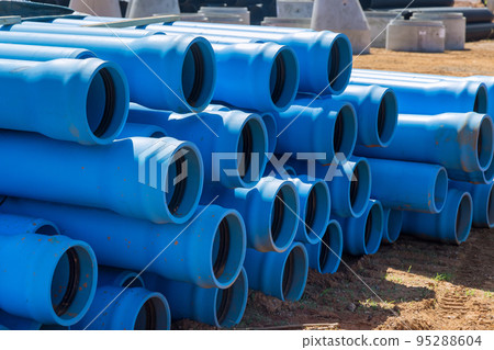New PVS blue plastic pipe is introduced for drainage septic system on construction site of new home New PVS blue plastic pipe is introduced for drainage septic system on construction site of new home 95288604