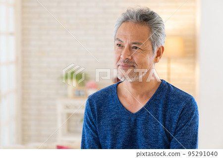 Senior man relaxing in the room 95291040