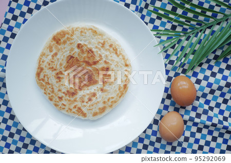 homemade roti chapati and egg on table . homemade roti chapati and egg on table . 95292069