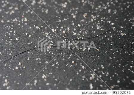 dandruff and hairs on black background dandruff and hairs on black background 95292071