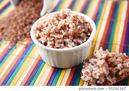 cooked red rice in a bowl on table , haradighi rice  cooked red rice in a bowl on table , haradighi rice  95292167