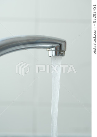 water pouring from a faucet tap slow motion water pouring from a faucet tap slow motion 95292451