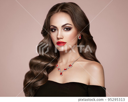 Brunette woman with curly hair Brunette woman with curly hair 95295313