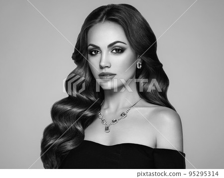 Brunette woman with curly hair Brunette woman with curly hair 95295314