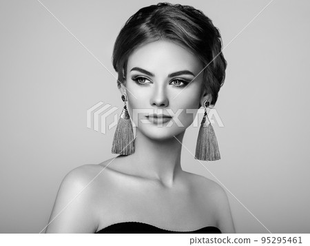 Beautiful Woman with Large Earrings Tassels 95295461