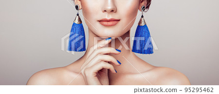 Beautiful Woman with Large Earrings Tassels 95295462