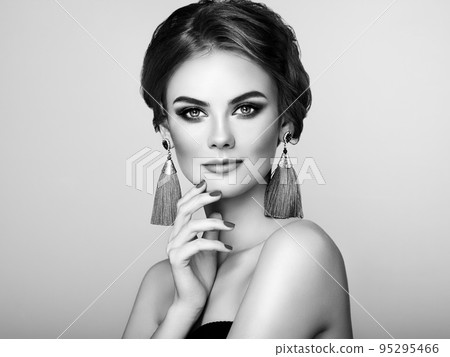 Beautiful Woman with Large Earrings Tassels 95295466