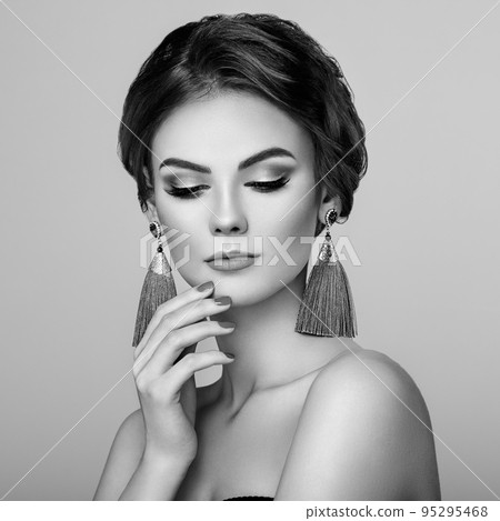 Beautiful Woman with Large Earrings Tassels Beautiful Woman with Large Earrings Tassels 95295468