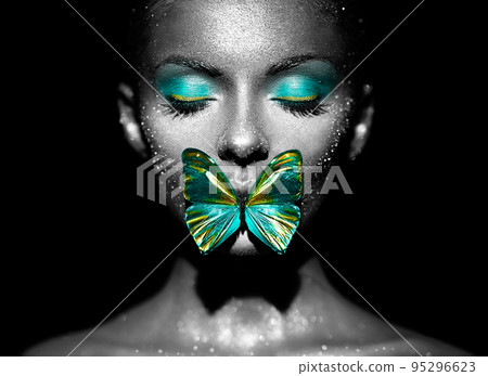 Beauty model woman with green butterfly 95296623