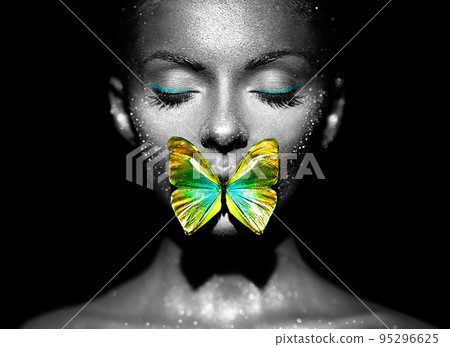 Beauty model woman with yellow-green butterfly 95296625
