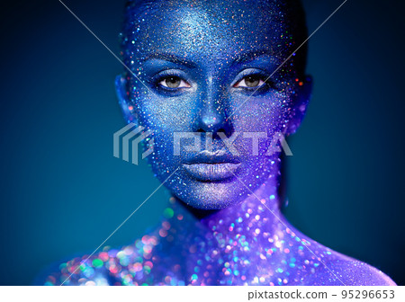 Portrait of beautiful woman with sparkles on her face 95296653