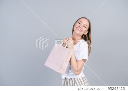 Seasonal sales and purchases. Portrait adorable happy female consumer walking 95297423