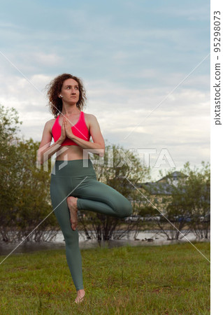 Yoga in the park serenity and relaxation Yoga in the park serenity and relaxation 95298073