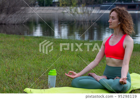 Yoga in the park serenity and relaxation Yoga in the park serenity and relaxation 95298119
