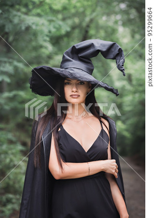 A beautiful witch in a hat A beautiful witch in a hat 95299664
