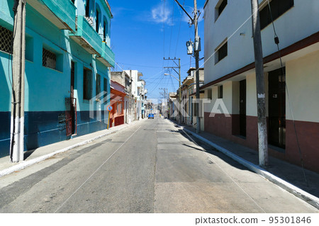 Typical street of Cuba with old cars Typical street of Cuba with old cars 95301846