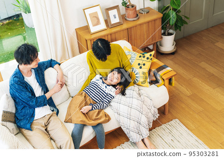 Family gathering together in the living room of the house Family gathering together in the living room of the house 95303281