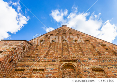 Facade of authentic gothic Zapyskis church of St. John the Baptist, Lithuania Facade of authentic gothic Zapyskis church of St. John the Baptist, Lithuania 95304100