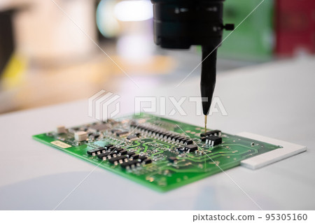 Automatic manipulator with dispenser needle during work with SMT pcb - close up 95305160