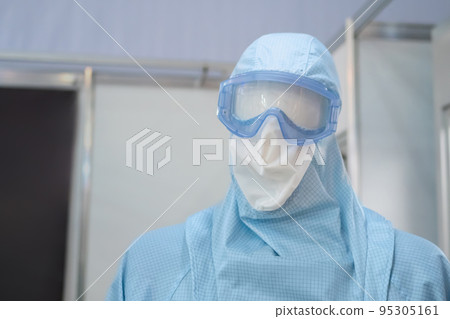 Protective medical clothing with hood and goggles at dummy 95305161