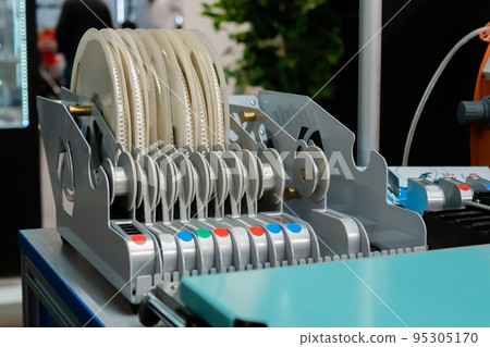 Reels with different electronic components, part of pick and place machine 95305170