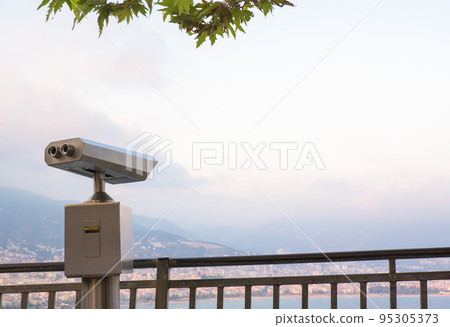 Binocular against observation deck view. Binocular against observation deck view. 95305373