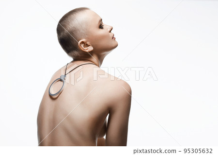 beautiful woman with short haircut. Back of naked bald Girl with Necklace beautiful woman with short haircut. Back of naked bald Girl with Necklace 95305632