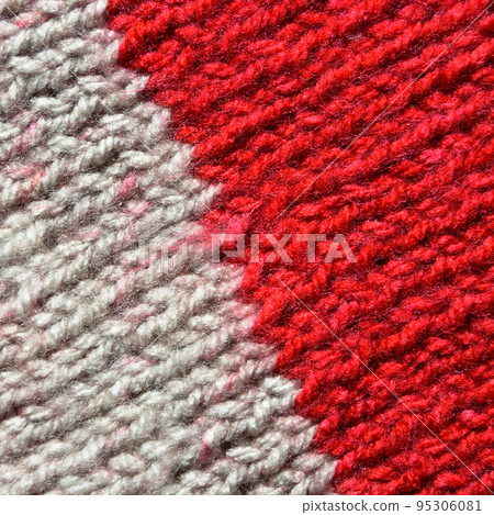 Handmade knitted fabric red and white wool background texture 95306081
