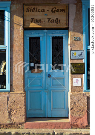Wooden blue door of nostalgic house in Cunda Island, Ali Bey Island, Ayvalik, Balikesir, Turkey september 11 2020 95306083