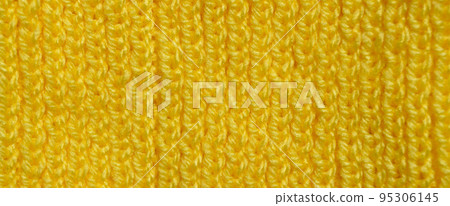Handmade knitted fabric yellow wool background texture Handmade knitted fabric yellow wool background texture 95306145