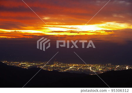 Nagano Basin at dusk seen from the Nozoki parking lot in Shiga Kogen, Nagano Prefecture Nagano Basin at dusk seen from the Nozoki parking lot in Shiga Kogen, Nagano Prefecture 95306312