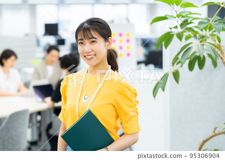 Young woman working in the office Young woman working in the office 95306904