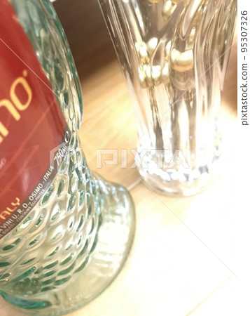 Empty bottle and vase of wine for Christmas 95307326