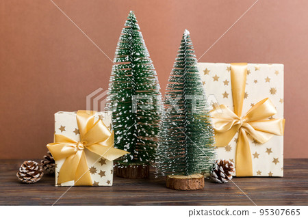 Christmas composition. craft Gift box, small tree, branches and craft DIY decorations on white background. New year concept. Christmas home decoration Flat lay, top view, copy space Christmas composition. craft Gift box, small tree, branches and craft DIY decorations on white background. New year concept. Christmas home decoration Flat lay, top view, copy space 95307665
