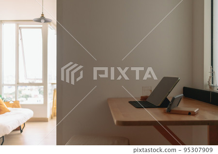 Work desk in home office corner of apartment for working from home. Work desk in home office corner of apartment for working from home. 95307909