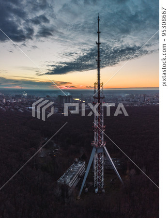 Aerial sunset vertical view with telecom tower Aerial sunset vertical view with telecom tower 95308667
