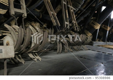 Attic in palm-stone building 95308986