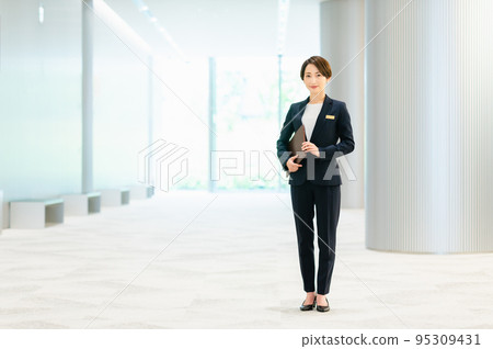 Female concierge greeted in the lobby Photo cooperation: LINK FOREST Female concierge greeted in the lobby Photo cooperation: LINK FOREST 95309431
