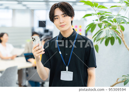 Young man working in the office Young man working in the office 95309594