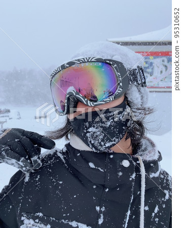 woman covered in snow woman covered in snow 95310652